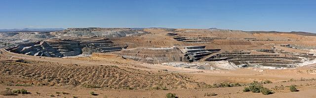 The U.S. Borax Boron Mine is the largest open-pit mine in California. It is probably the largest borate mining operation in the world. The pit is a mile long, half a mile wide and 500-feet deep. The company, a subsidiary of Rio Tinto, extracts several borate minerals from an ancient lakebed that had been buried by alluvium. Near Boron, San Bernardino Co., Calif.